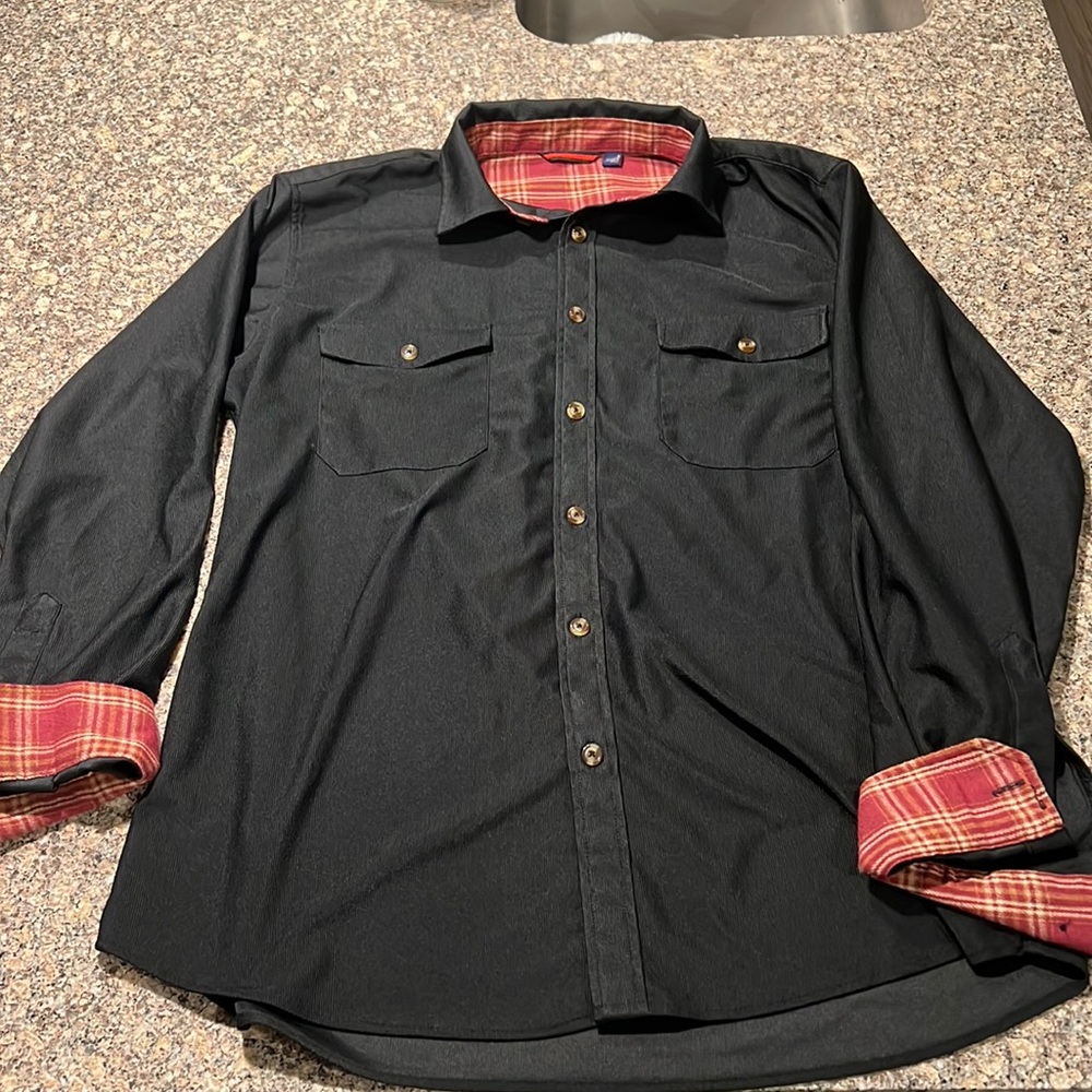 Black corduroy button down shirt. Red flannel on inside of collar/sleeves